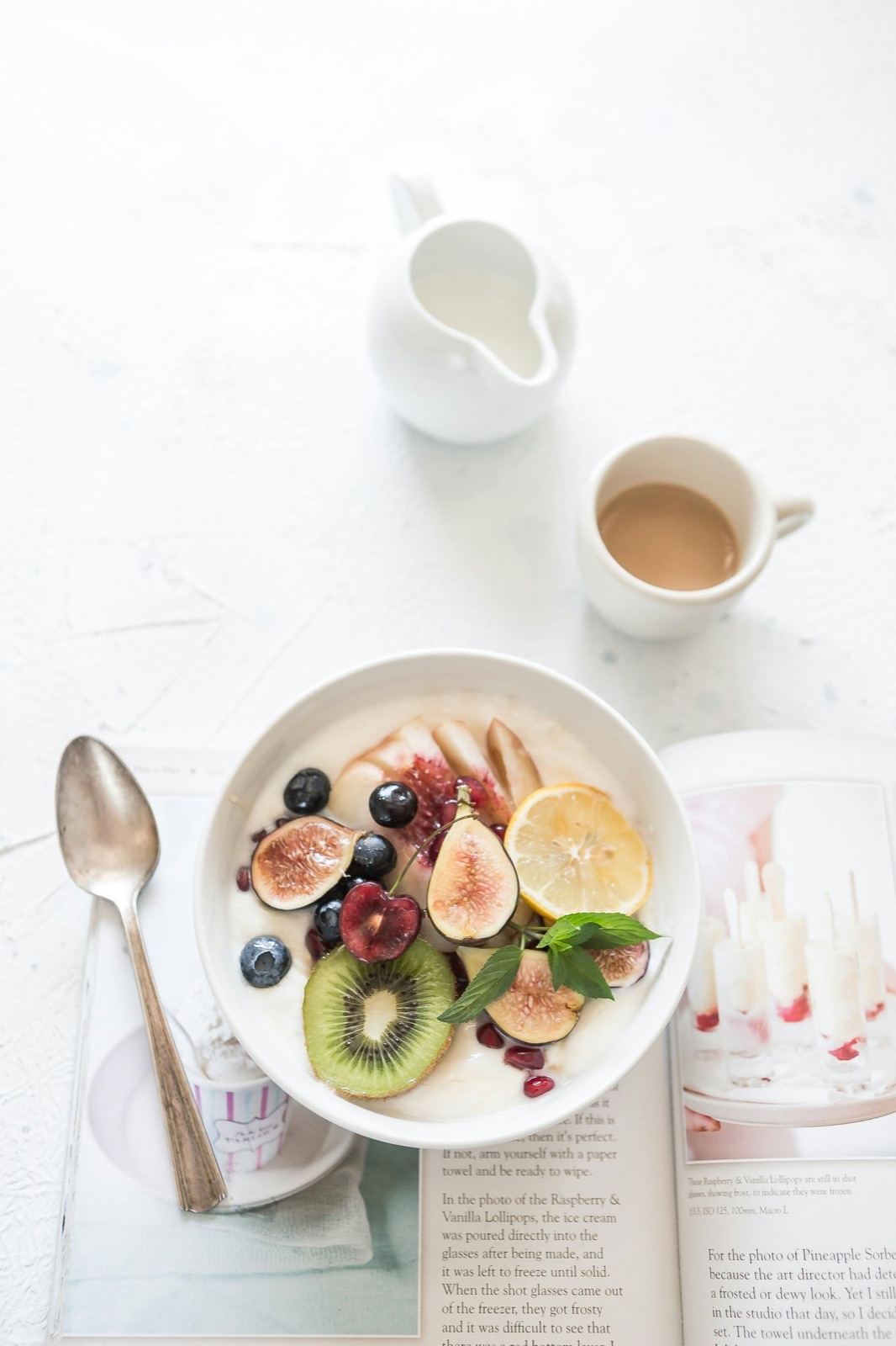 A bright breakfast bowl with figs, berries and lemon